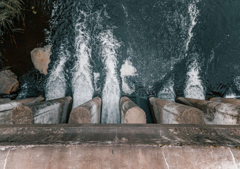dam showcasing turbulent flow and water management.