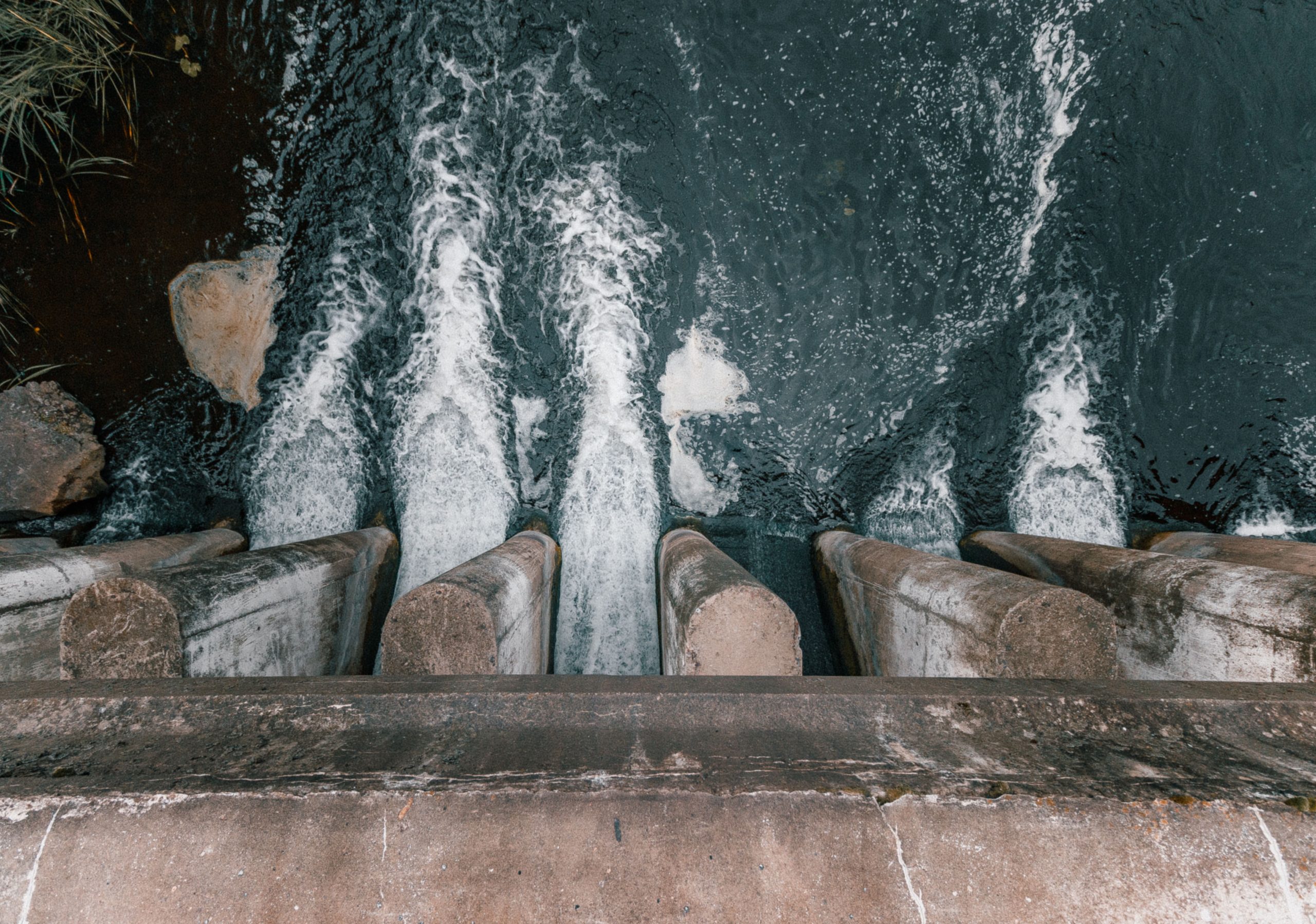 dam showcasing turbulent flow and water management.